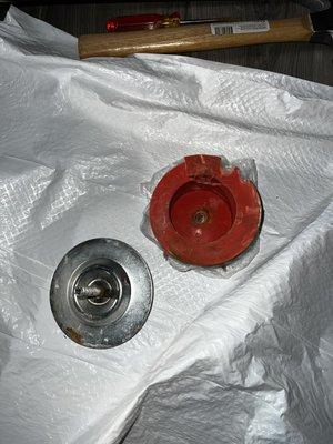 The cap that Ewert found acceptable to use to close the pipes off. its both missing a piece and heavily damaged.