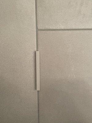 Grout sample compared to what they used