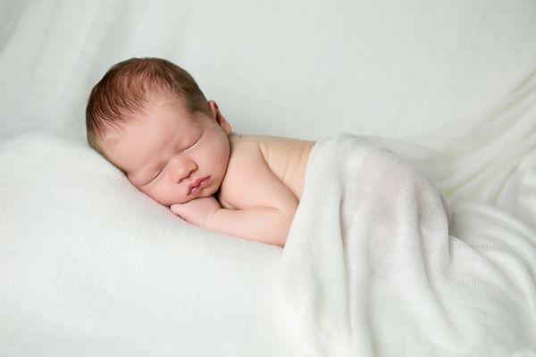 This newborn looks so fresh and sweet for his baby portrait session.