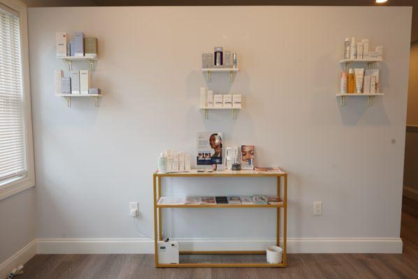 Wall of retail products, from SkinMedica®, Avéne, and Glytone.