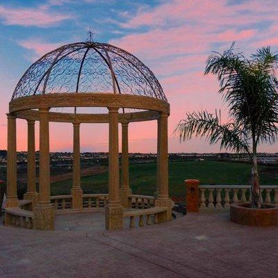 Hand carved sandstone and iron gazebo.