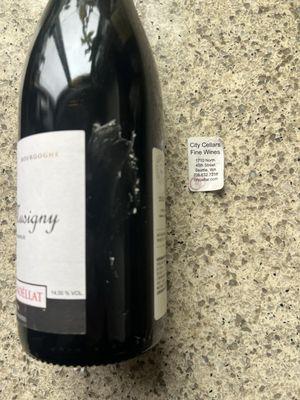 Wine bottle stickered with store information, it wasn't clean or easy to take off.