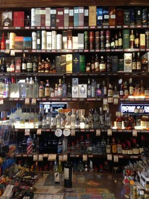 huge liquor shelf with much to choose from!