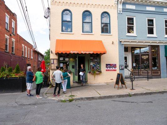 Step into a realm of Fine Southern Goodness as you gaze upon the charming exterior of Hattie's Downtown Saratoga Springs.