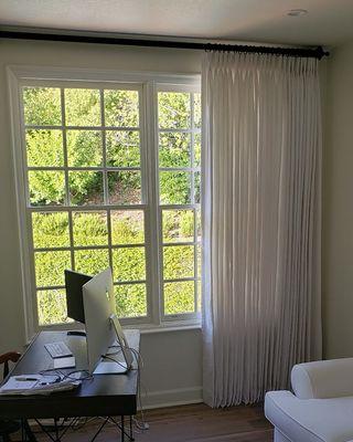 One way draw drapes installed with iron rod