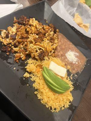 Scrambled eggs w/ chorizo, rice, beans, & Avacado