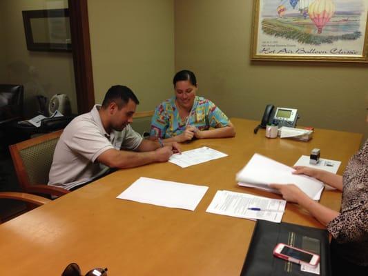 Ali and Victor signing the closing documents on their first home in Santa Rosa! We absolutely love them!