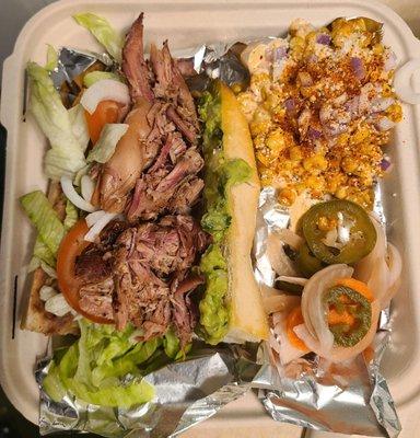 Smoked pork&chicken, sourdough roll,refried beans,onions,lettuce,cilantro,tomato, guac.Street corn, pickled onions, jalapeños, carrots.