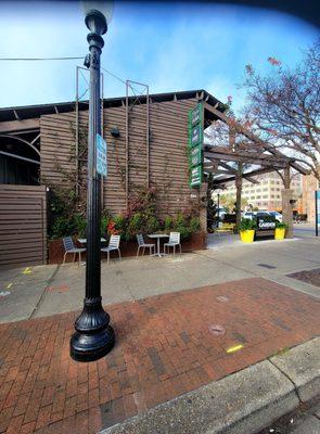 Dec 2021: Pic 3 of 3-- tables, chairs, & a variety of food trucks under one roof