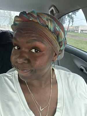 My head wrap which is tightened and secured to my head & not a safety risk.