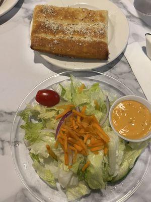 Salad and breadsticks