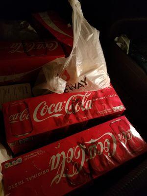 Coke leaking all over my car, 3 - 12 packs, and all my bagged groceries stuck to each other.