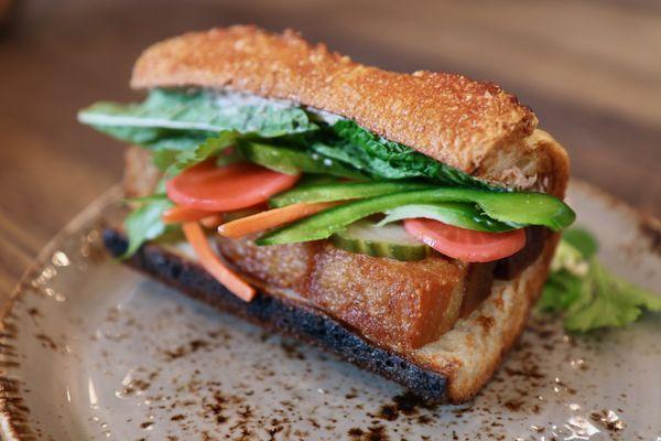 Bahn Mi on lunch menu.  Crispy pork belly, patê, seasonal house pickles,  jalapeno, baguette.