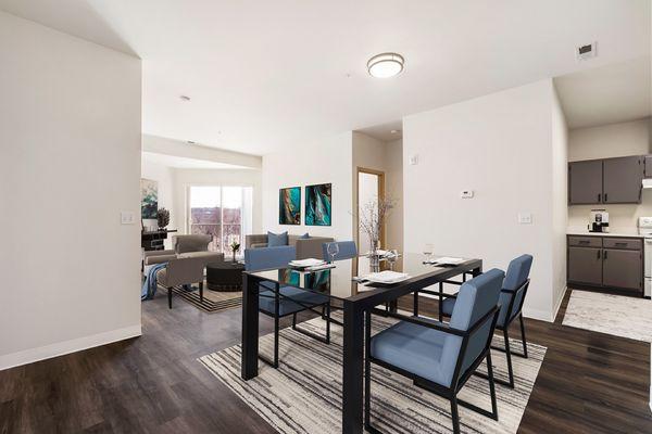 Shoreline Village Apartments in Richland, WA - Bright, clean living room and dining area with faux wood flooring and large windows.