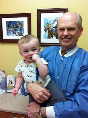 Dr. Lewis with his grandson.