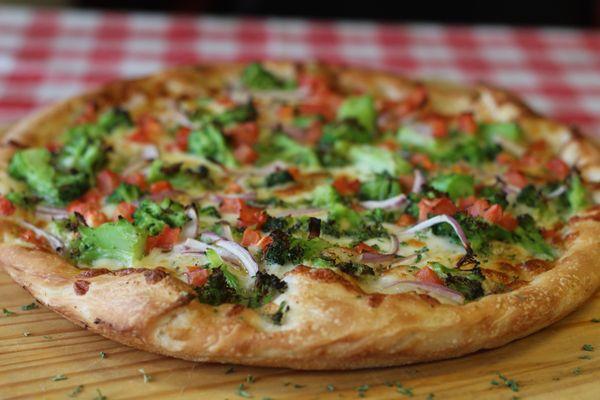 Deluxe veggie pizza with homemade white garlic butter sauce