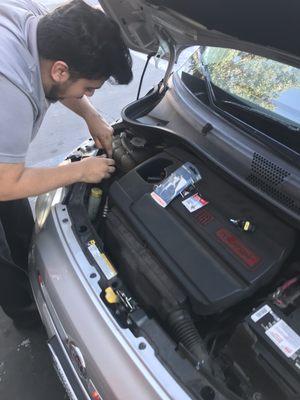 Omar showing me how to replace the headlights in seconds.