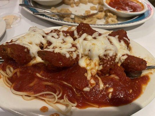 Shrimp parmigiana over linguini