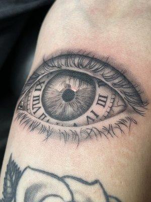 Black and grey realistic eye of time.