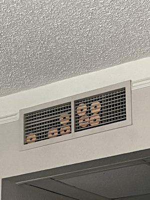 Air fresheners stuffed into fan