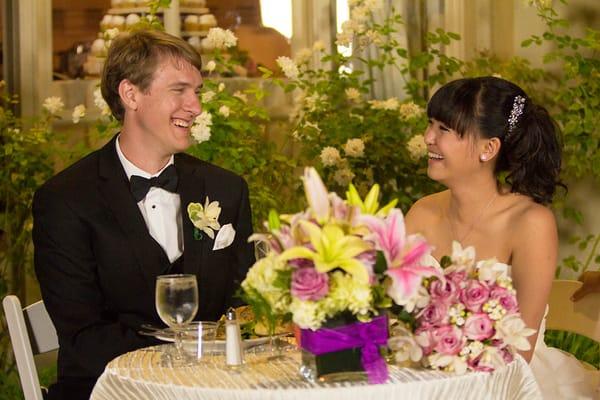 Groom's boutonniere (Orchid), beautiful centerpiece for sweetheart table, and the bridal bouquet.