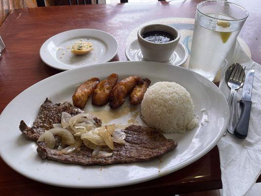 Palomilla, fried plantains, black beans & rice