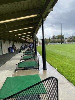 New golf driving range stalls and grass