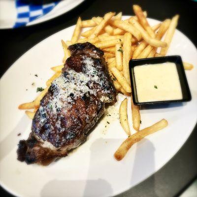 Steak frites (12 oz NY strip with garlic herb butter, fries, and house aioli)