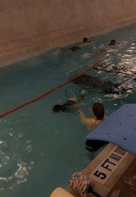 Son swimming ‍ through hoop!