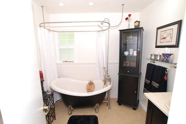 Slipper tub with tile sainscot, apothocary & handheld tub with tub filler, with oval shower curtain ring.