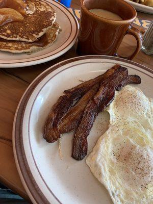 Buttermilk, pancakes, bacon, and eggs