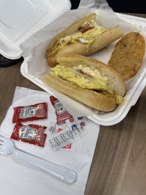 Awesome breakfast sandwich on a hoagie roll and a hash brown - love that he serves breakfast all day!