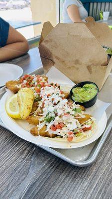 Fish tacos and Chips with Guacamole box. Excellent lunch for 2!