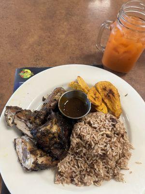 Jerk chicken with rice and peas, and fried plantains. Ginger carrot juice to wash it down.