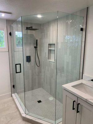 Custom neo angle glass shower door with matt black hardware