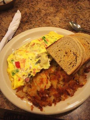 Omelette wit hush browns and a toast