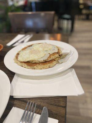 Over easy eggs and chocolate chip pancakes