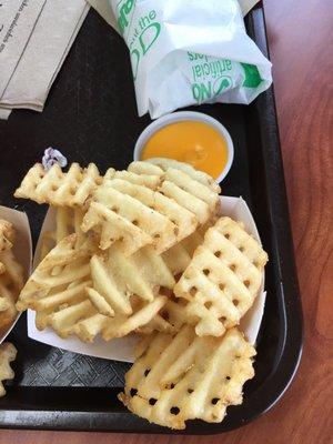 Waffle fries with cheese sauce