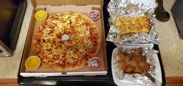 Pepperoni pineapple pizza with extra cheese. Garlic rolls (Top right) Cinnamon rolls (Bottom right)