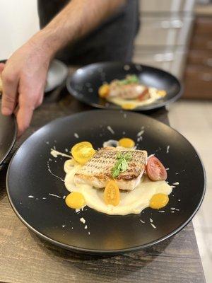 Striped bass with cauliflower purée, cherry tomatoes and sauce vierge