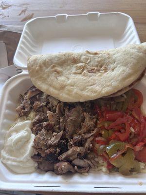 Pork Rice Bowl: original Gyro with rice pilaf, pita, sauté onion and peppers, garlic sauce. Very delicious and filling. I can only eat half!