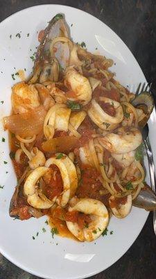 Seafood trio in a plum tomato sauce