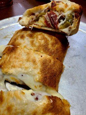 Sausage, pepperoni, onion, and peppers Stromboli mini - plenty to feed 2-3 people!!!