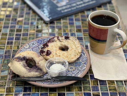 Coffee and blueberry bagel