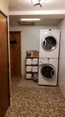 Complementary guest laundry area and sauna.