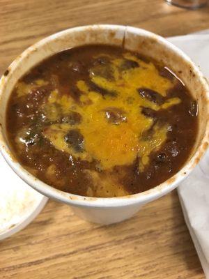 Veggie chili with melted cheddar cheese