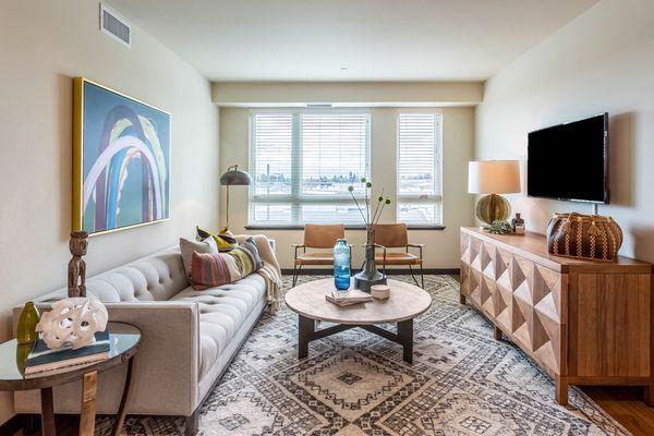 Staged living room with oversized windows