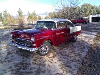 This is his classic 1955 Chevy Bel Air that he painted complete, candy brandy wine and a blue pearl white