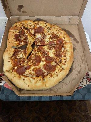 A perfectly fine, slightly shifted, delivered pizza.