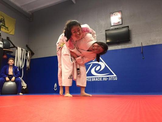 The girls working on hip throw.